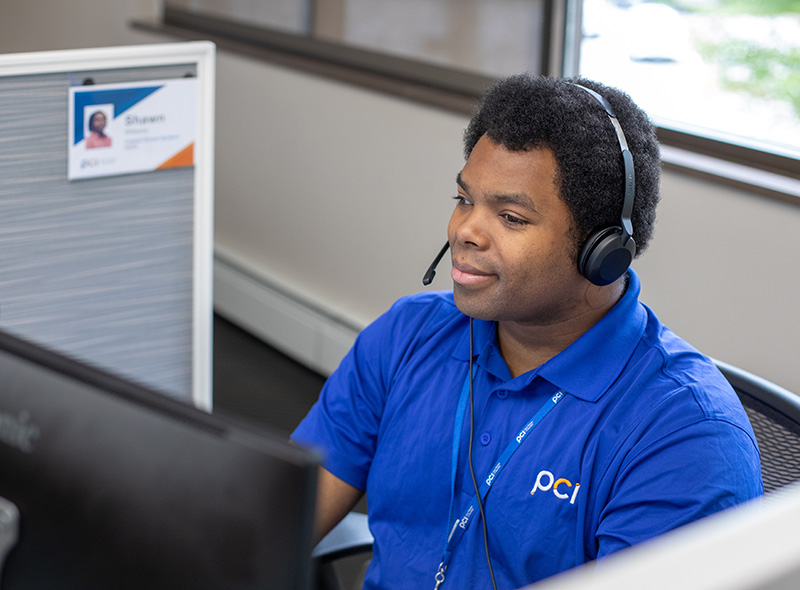 employee in blue polo with headset